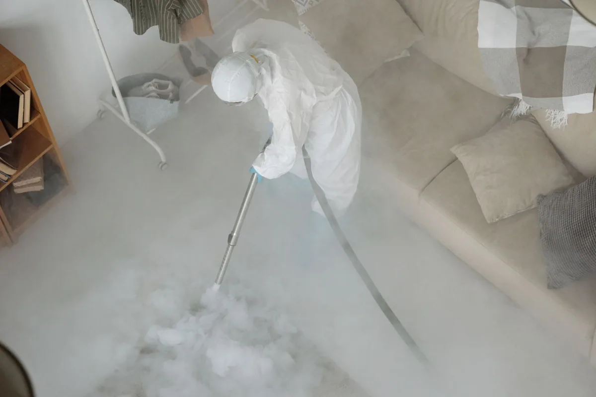 Biohazard cleanup technician in protective equipment, West Liberty, WV